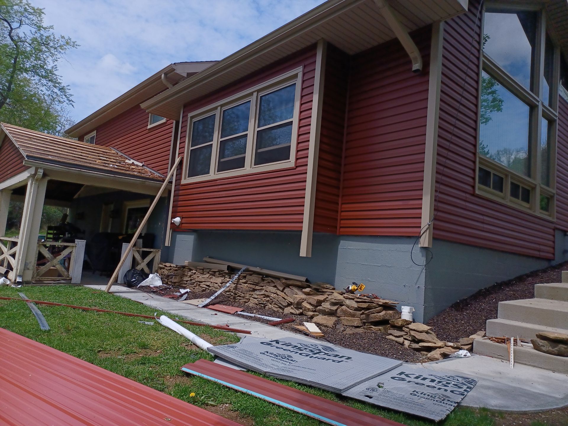 Ac-Cel finished home remodeling project — red house with new windows